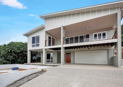 Two-storey home with upstairs balcony, double garage and new driveway