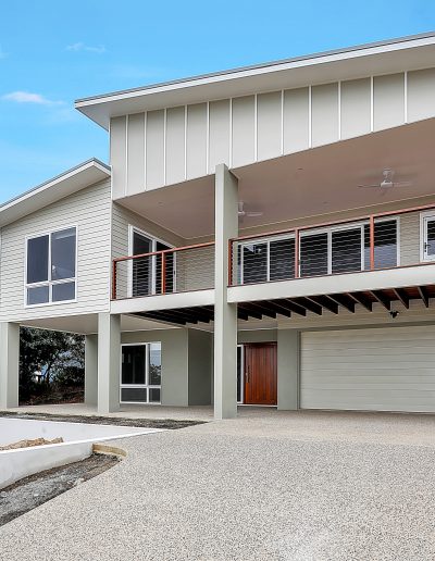 Two-storey home with upstairs balcony, double garage and new driveway